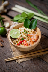 Close-up shot Instant noodles with lemon shrimp chilli hot and spicy on old wooden table select focus shallow depth of field