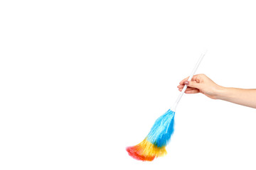 Hand with soft colorful duster, synthetic feather broom, fluffy cleaner.