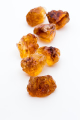 Brown caramelized sugar on white background.