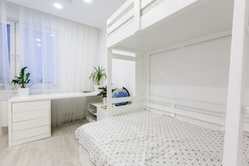 Child's room with white bed and Light color window