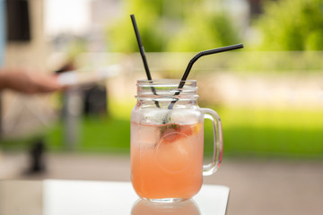 glass of orange cocktail