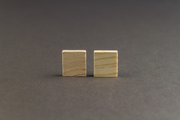 Two children wooden blocks in line, landscape