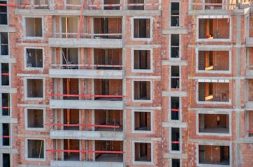 Fototapeta na wymiar floors of a building under construction with concrete slabs and bricks