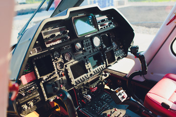 Black control panel in a helicopter cockpit. © Евгений Вершинин