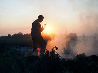Fire in the field. Volunteers fighting the fire