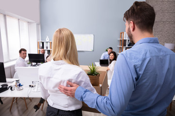 Manager Welcoming New Employee Introducing Her To Colleagues