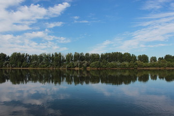 Fototapeta na wymiar landscape with lake and blue sky and forest