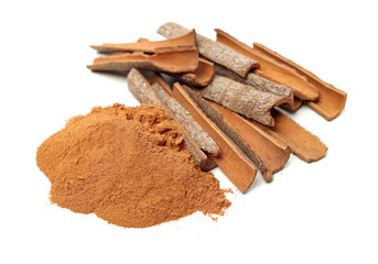 Cinnamon Sticks and Ground Cinnamon on a white background