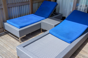 Two beach loungers in the sun. Water Villa, Maldives