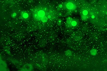 green fantastic shining glitter lights defocused bokeh abstract background with sparks fly, festal mockup texture with blank space for your content