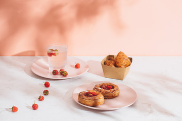 Freshly baked traditional pastry sweet mini danish raspberry and raspberries soda drinks