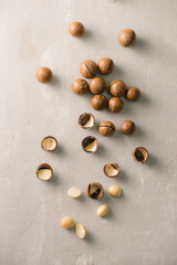 Superfood. Organic macadamia nut on stone background.