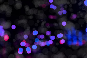 Blurry background image of defocused colorful abstract city street lights at night