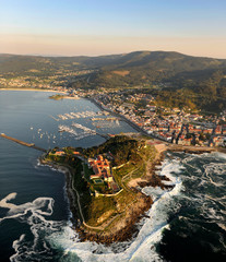  aerial image of the coastal city of baiona in pontevedra, galicia