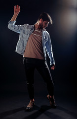 Fashionable stylish serious minded brutal young man