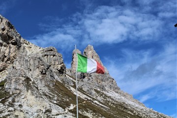 The Italian flag with the mountains