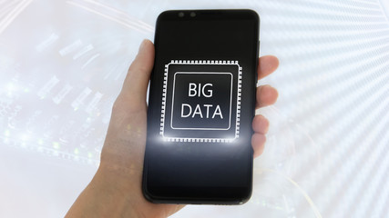 Big Data concept with hand holding modern smart phone. Server room background.