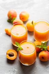 Fresh apricot juice on the marble table