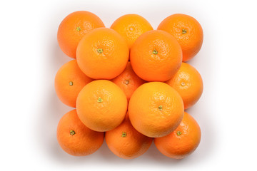 Pyramid of Oranges isolated on white background.