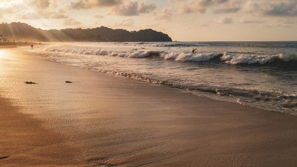 Sunset with palm trees in Sayulita beach, Nayarit, Mexico