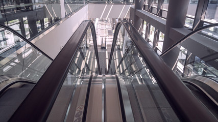 Moving escalator in interior of office building