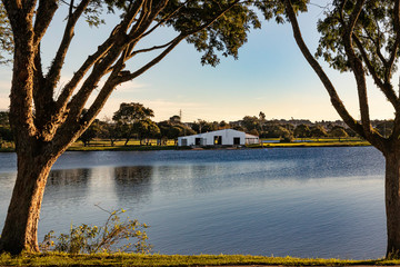 Boathouse beside the river on a sunny afternoon