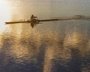 Lonely rower training at the sunset © Alfonso