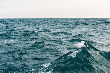 dark blue sea water background, shades of blue in black sea