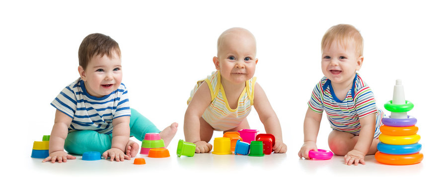 Nursery babies toddlers playing with toys isolated on white background