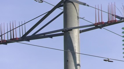 Protection from birds on power lines. Bird protection of high-voltage power lines of the new generation. Electric pole with protection against birds. Power line traverse.