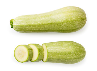 Ripe zucchini, half and pieces on a white. The form of the top.