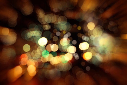 Blurry background image of defocused colorful abstract city street lights at night