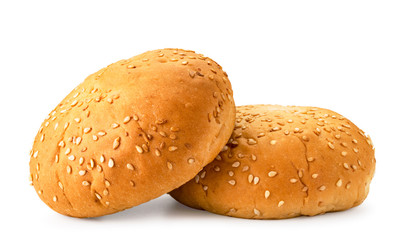 Two buns with sesame seeds closeup on a white. Isolated.