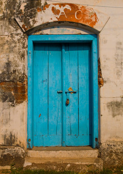 Old Blue Wooden Door With A Padlock Surrounded By Decrepit Walls, Kochi, India