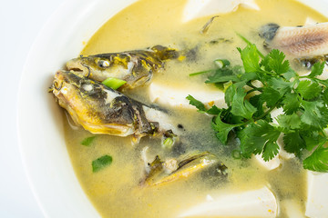 Chinese gourmet fish soup, a large bowl of yellow bone fish tofu soup on a white background