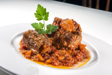 Dish with portion of oxtail stewed