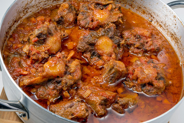 Isolated pan with oxtail stewed vaccinara