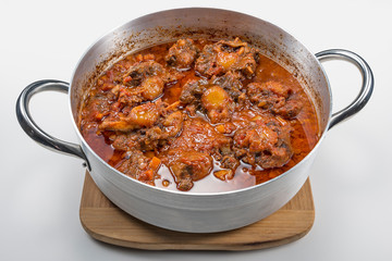 Isolated pan with oxtail stewed vaccinara