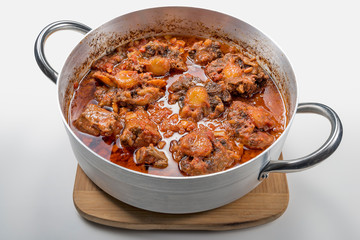 Isolated pan with oxtail stewed vaccinara