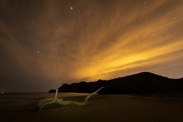 Fototapeta na wymiar Night landscape on the beach of Monsul. Natural Park Cabo de Gata. Almeria. Spain.