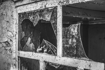 Broken glass in an old wooden window