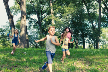 Playful  kids running in the park.