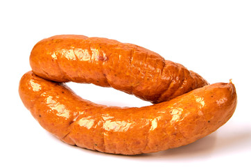 Meat sausages on a light background. The concept of traditional cuisine.