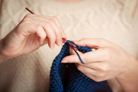 Close-up of hands knitting