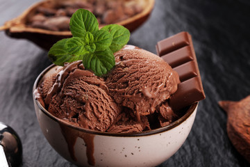 Chocolate coffee ice cream ball in a bowl. ice cream scoop