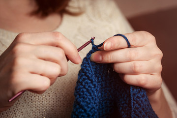 Crochet. Woman Crochet Dark Blue Yarn. Close-up Of The Hands.