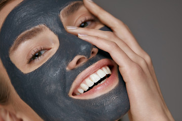Beauty face skin care. Woman with cosmetic spa facial mask