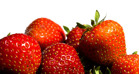 Close-up on strawberries isolated on white background.