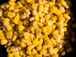 Top close-up view of canned sweet corn.