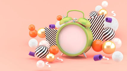 Clock surrounded by colorful balls on a pink background.-3d rendering.